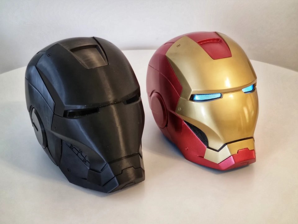 Two printed character helmets showing unfinished and painted finishes
